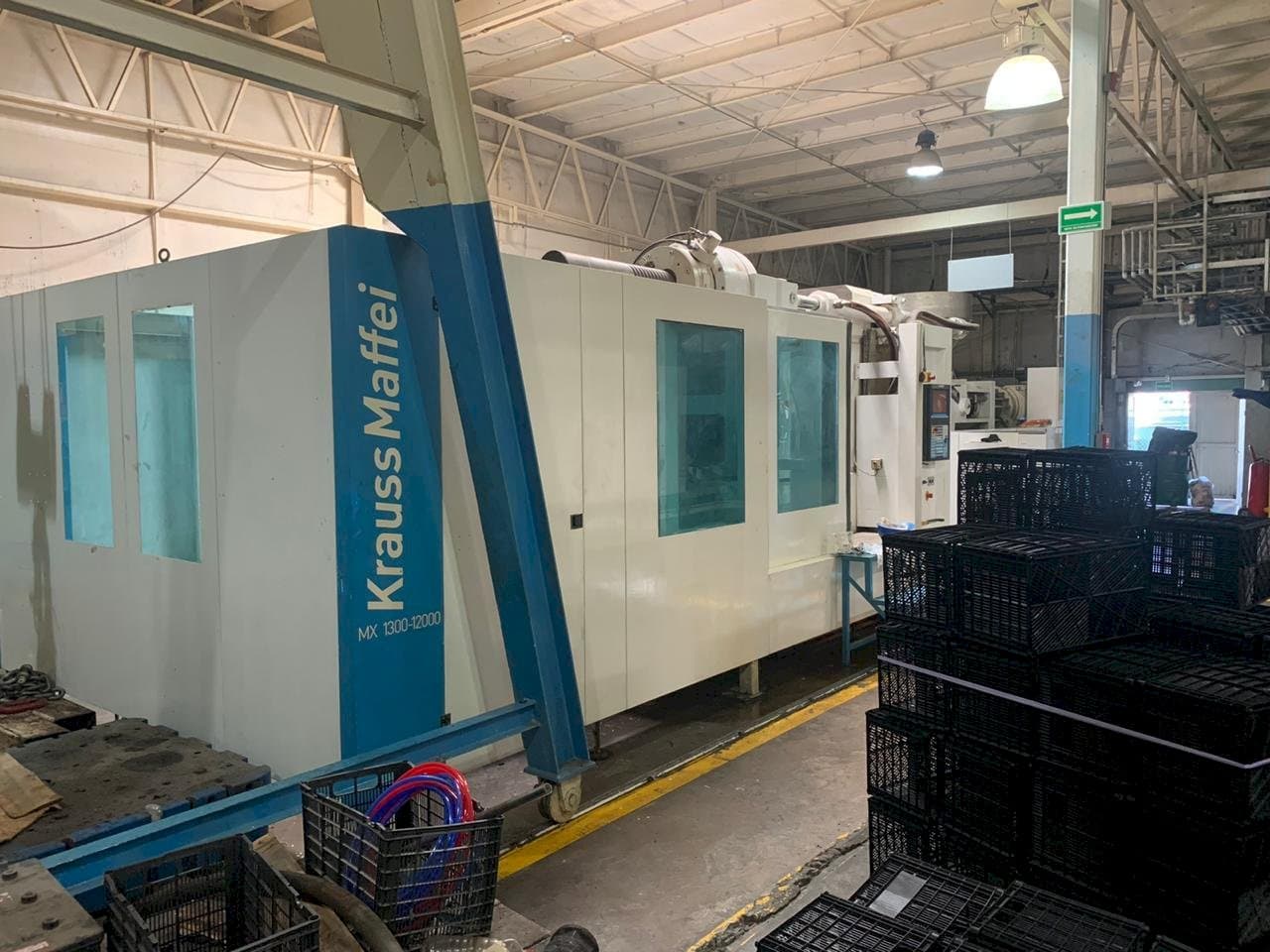 Vooraanzicht van Krauss Maffei 1300-12000 MX machine