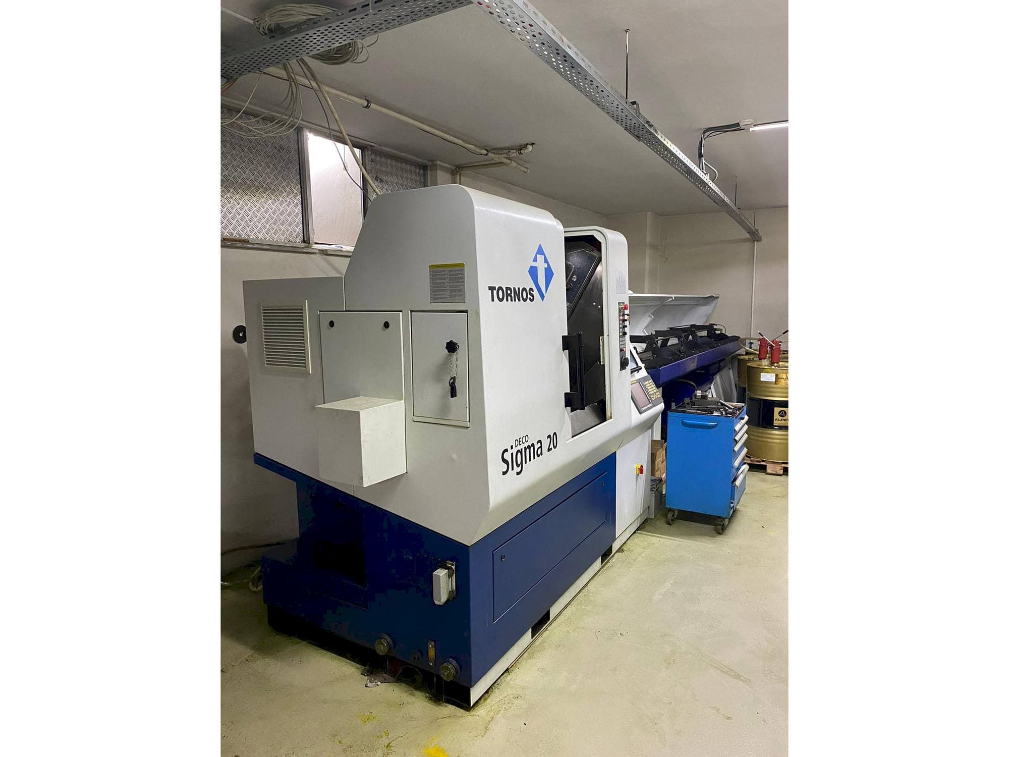 Linkerzijdeaanzicht van Tornos Delta Sigma 20 machine