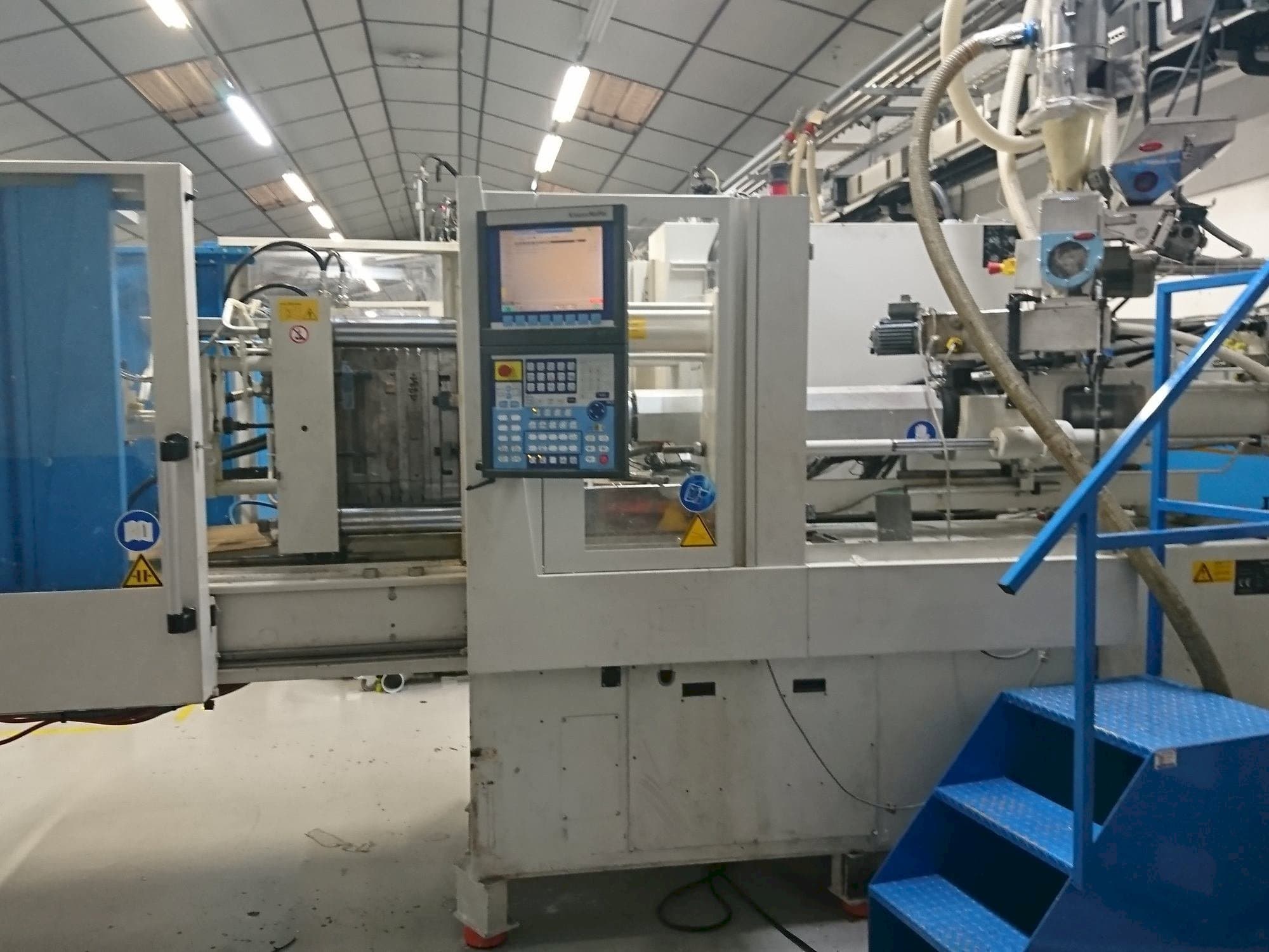 Vooraanzicht van Krauss Maffei 80-750 CX machine