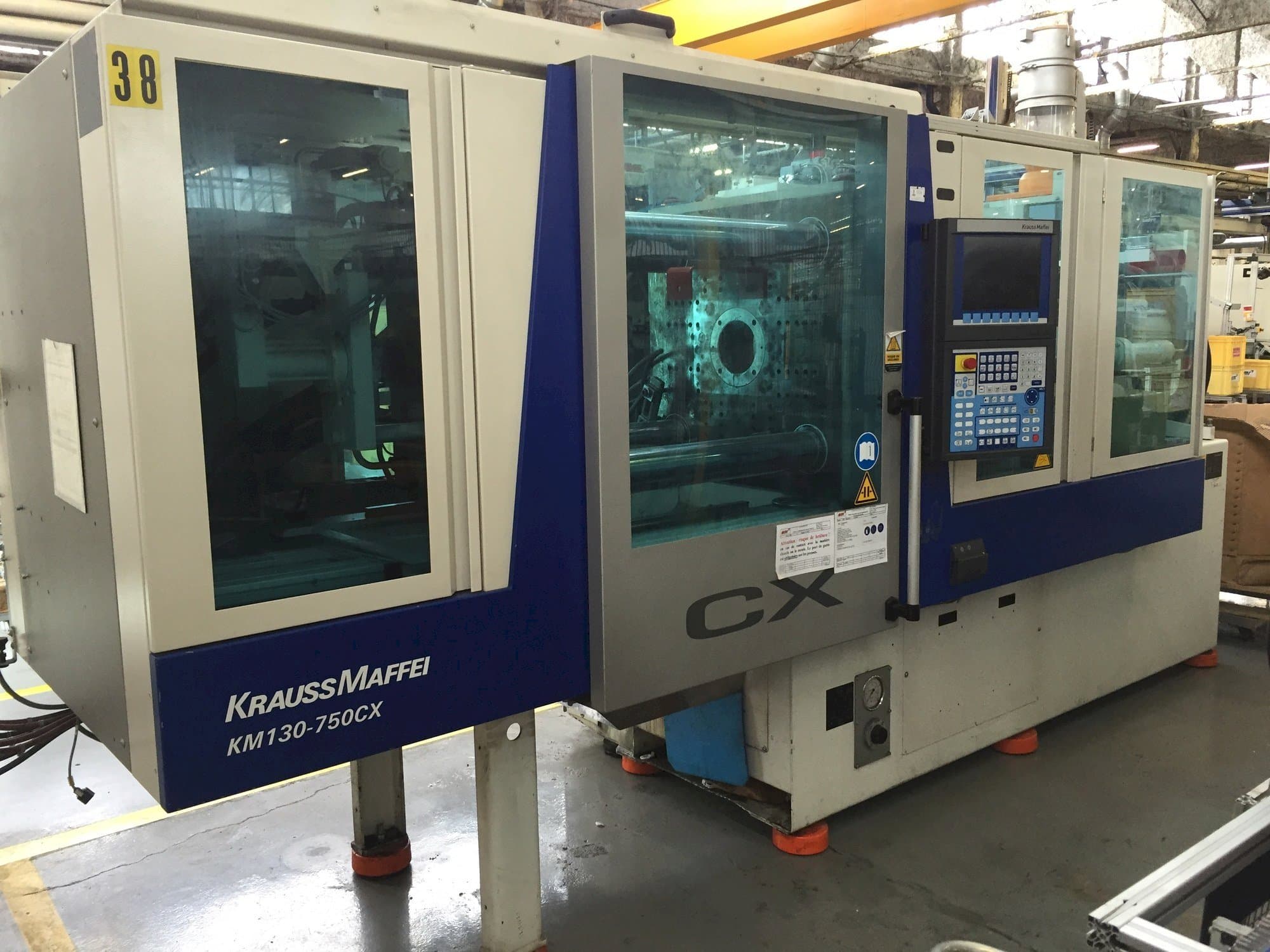 Vooraanzicht van Krauss Maffei 130-750 CX machine