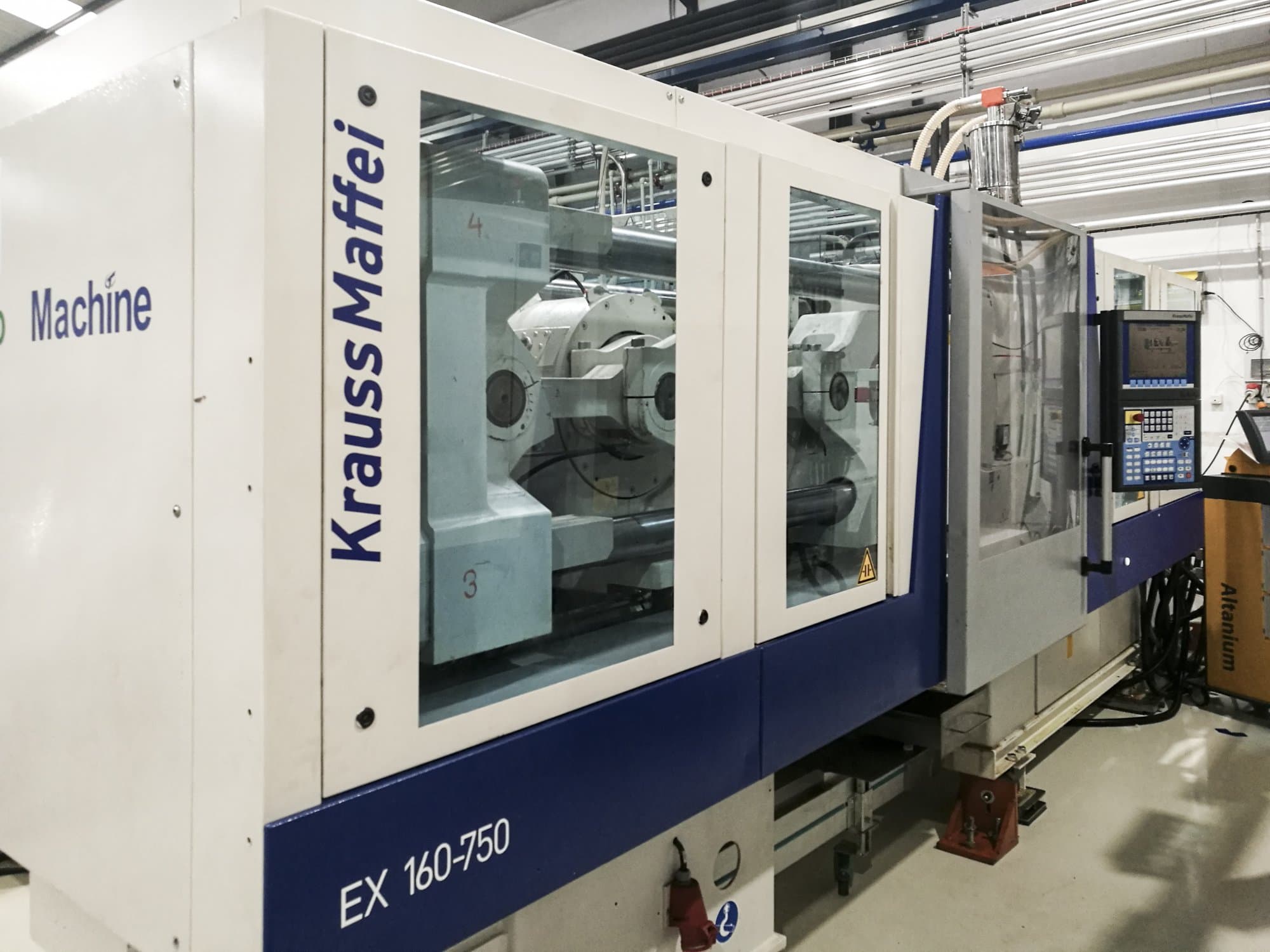 Links zicht van Krauss Maffei 160-750 EX machine