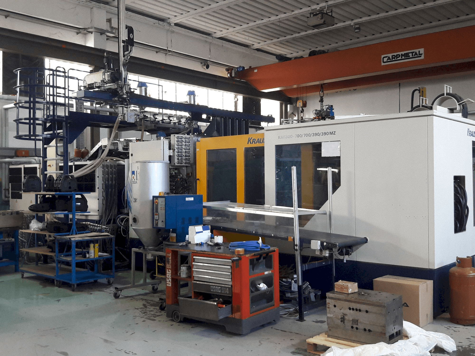 Vooraanzicht van Krauss Maffei 1300-700-700-390-390 MZ machine