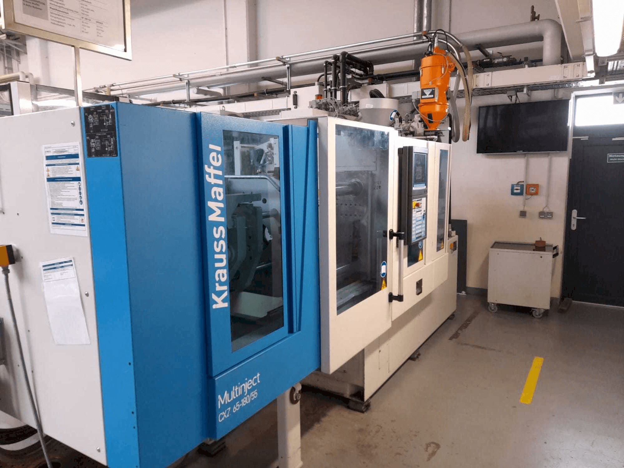 Vooraanzicht van Krauss Maffei KM 65/80 CX machine