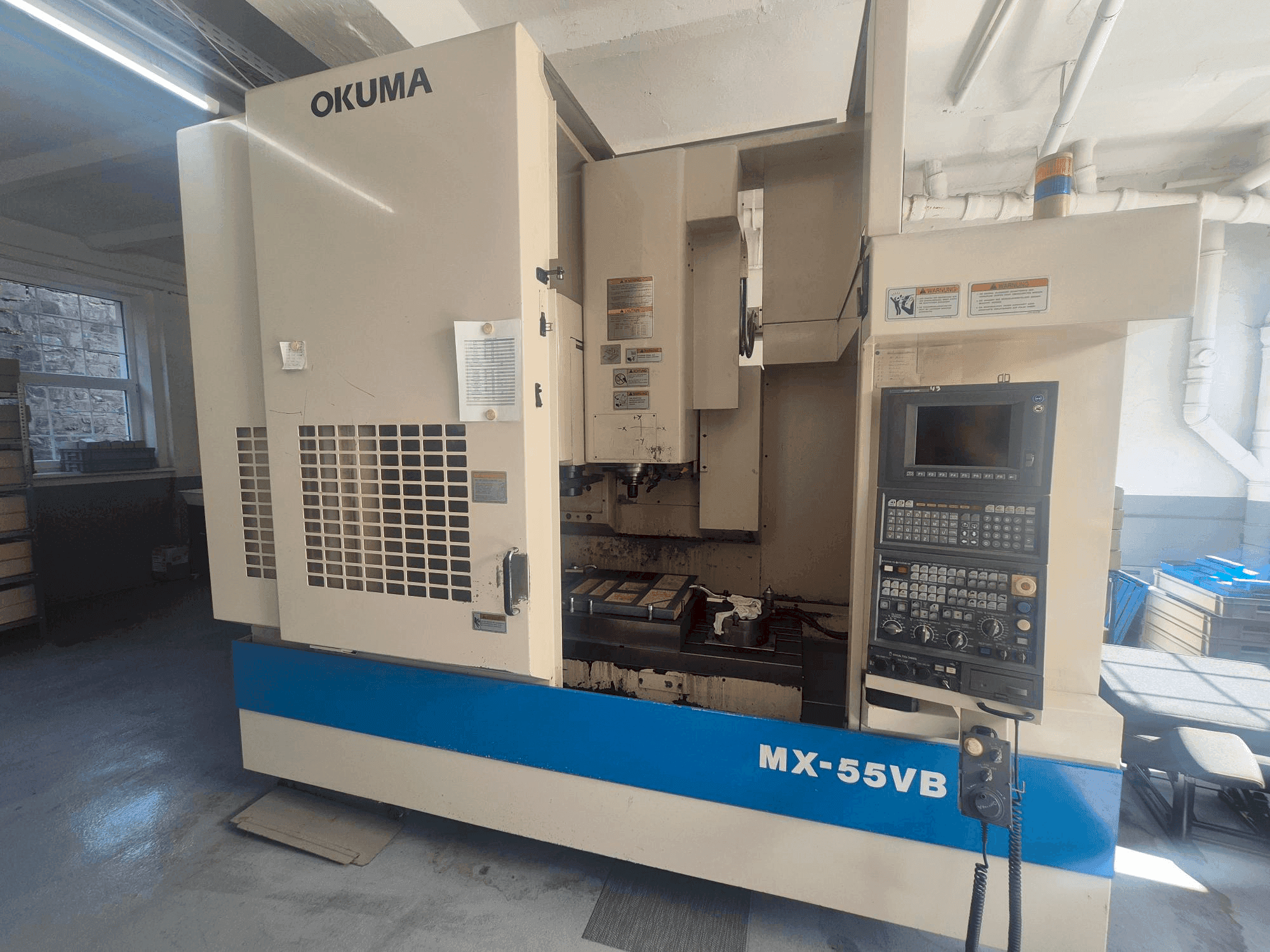 Vooraanzicht van Okuma MX-55VB machine