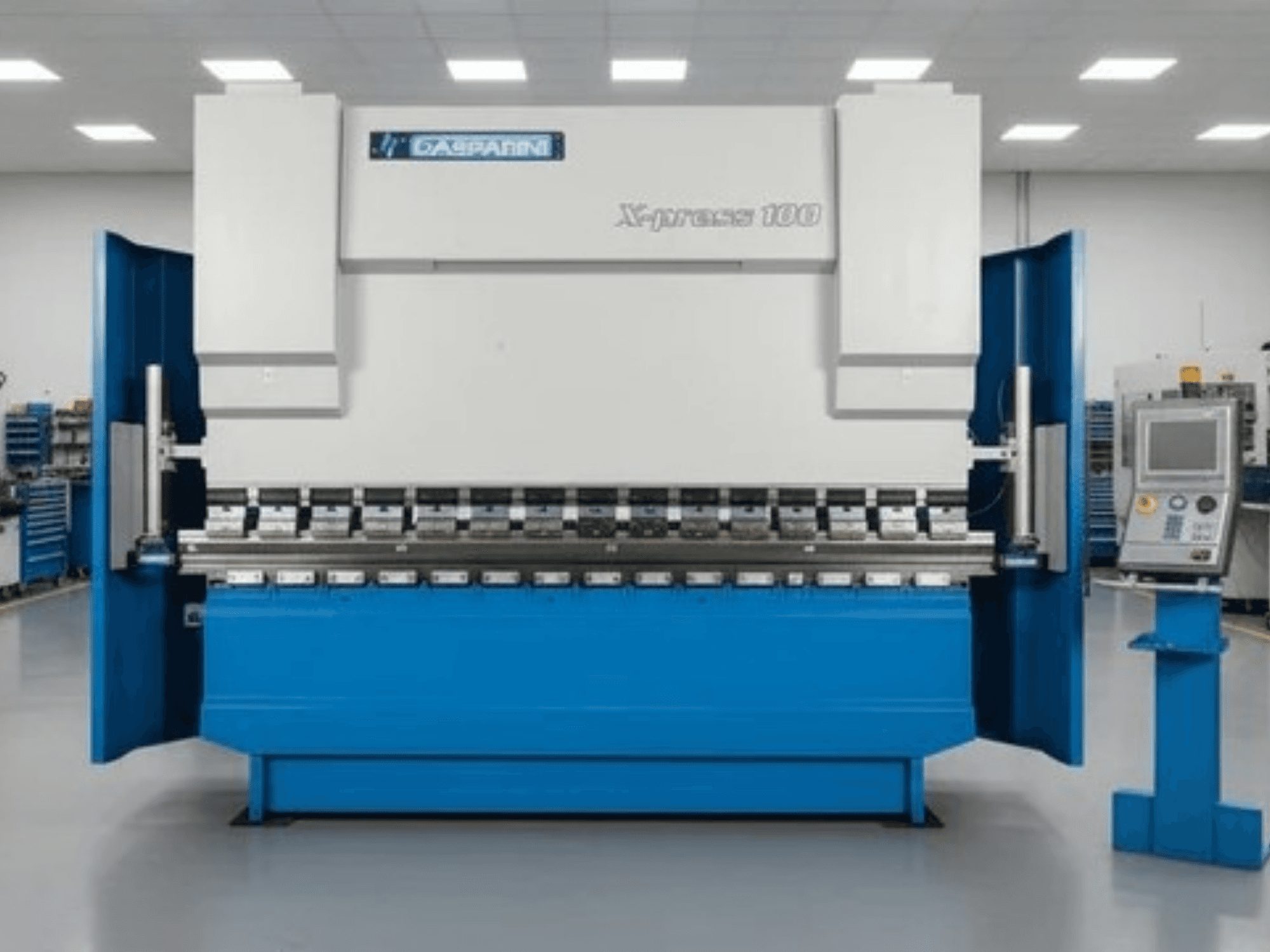 GASPARINI X-Press 100 hydraulische pers, vooraanzicht, met blauwe behuizing en bedieningspaneel aan de rechterkant.