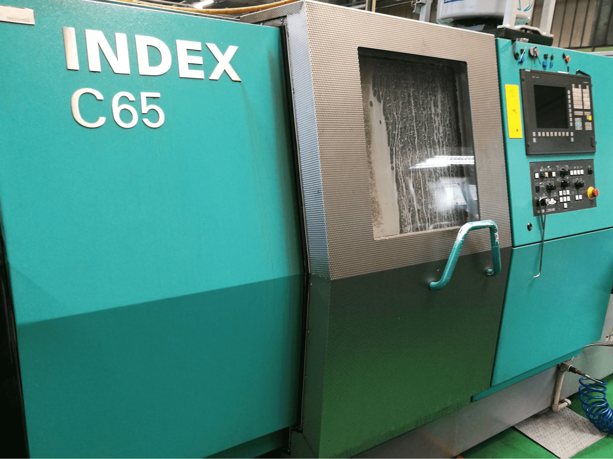 Links zicht van Index C65 machine
