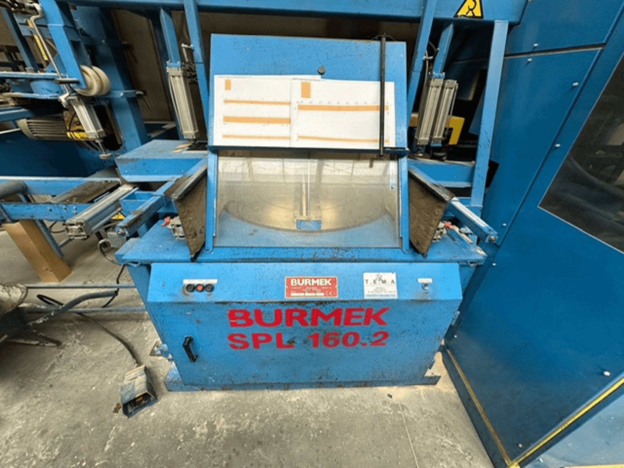 Blauwe BURMEK SPL 160.2 houtmachine, vooraanzicht, met bedieningsknoppen en een glazen paneel dat het interieur laat zien.