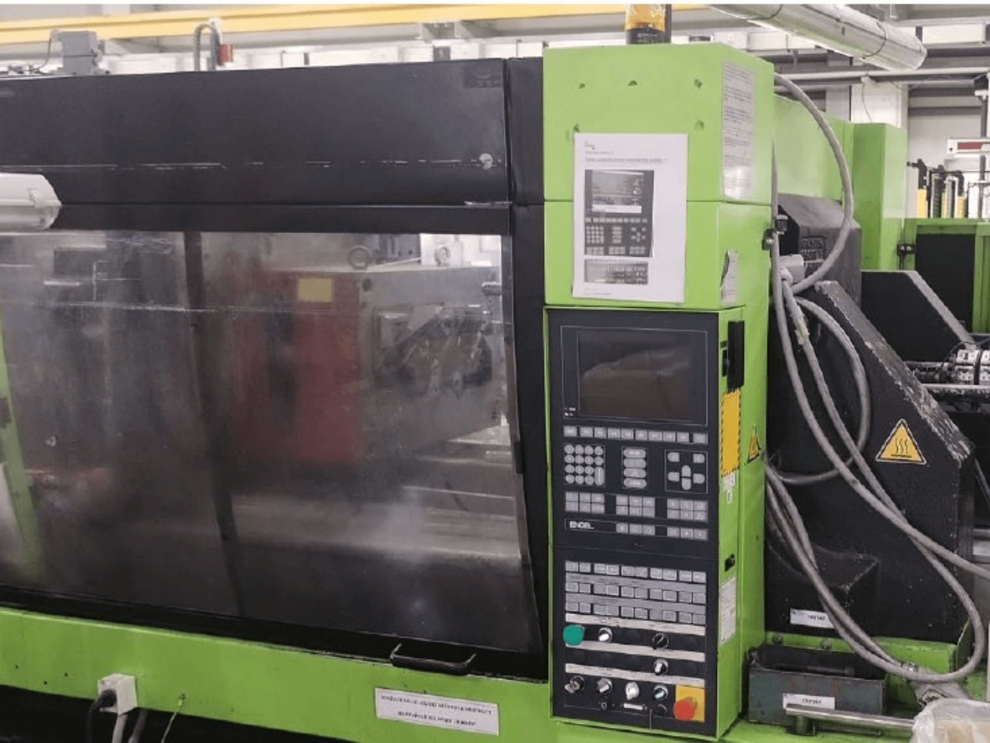 Engel ES 1050/275 HL-V hydraulische spuitgietmachine, zijaanzicht met bedieningspaneel en functionele details.