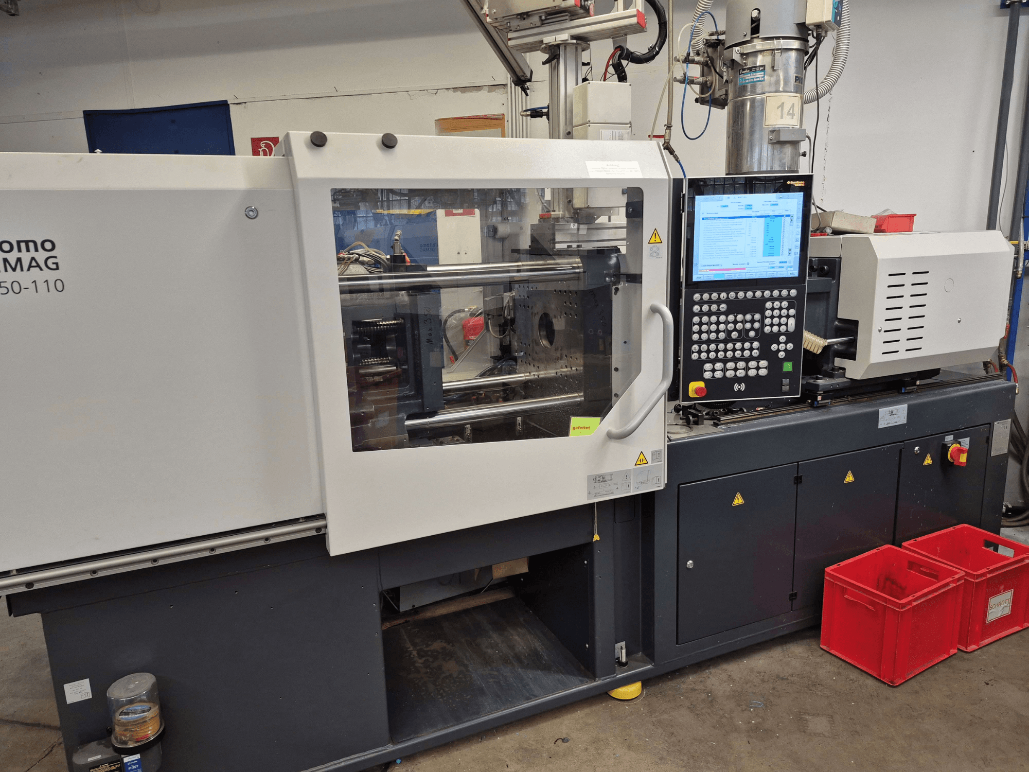 SUMITOMO SHI DEMAG Intelect 2 50/360-110 elektrische spuitgietmachine, zijaanzicht met zichtbaar bedieningspaneel en veiligheidsvoorzieningen.