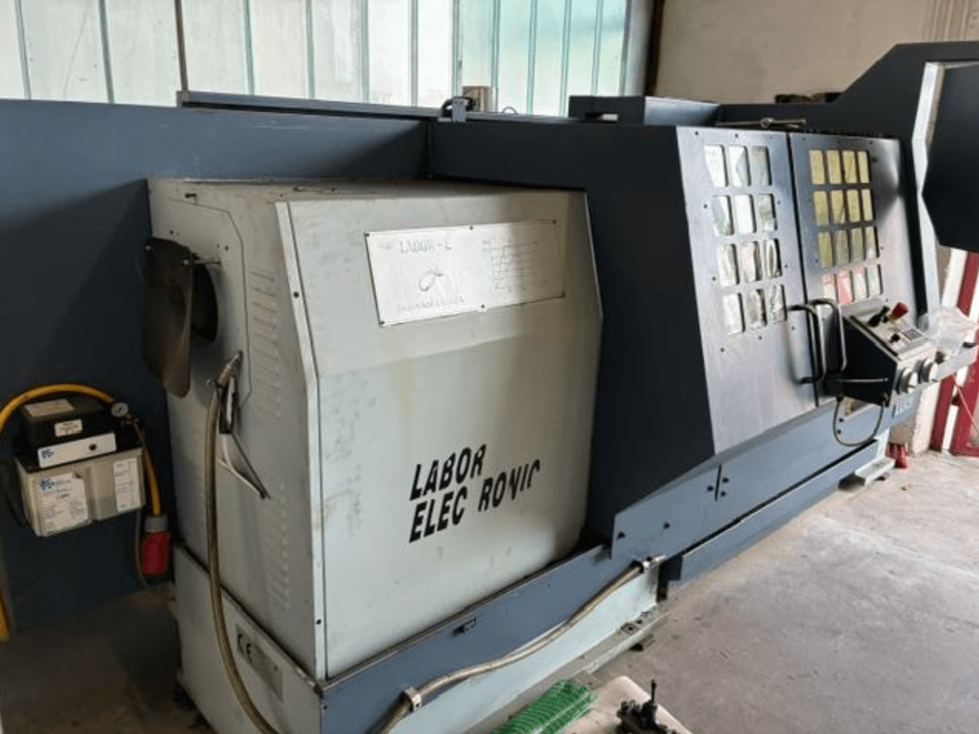 Horizontale draaimachine PADOVANI E255/1500, zijaanzicht met bedieningselementen, elektrisch paneel en bedieningsfuncties.