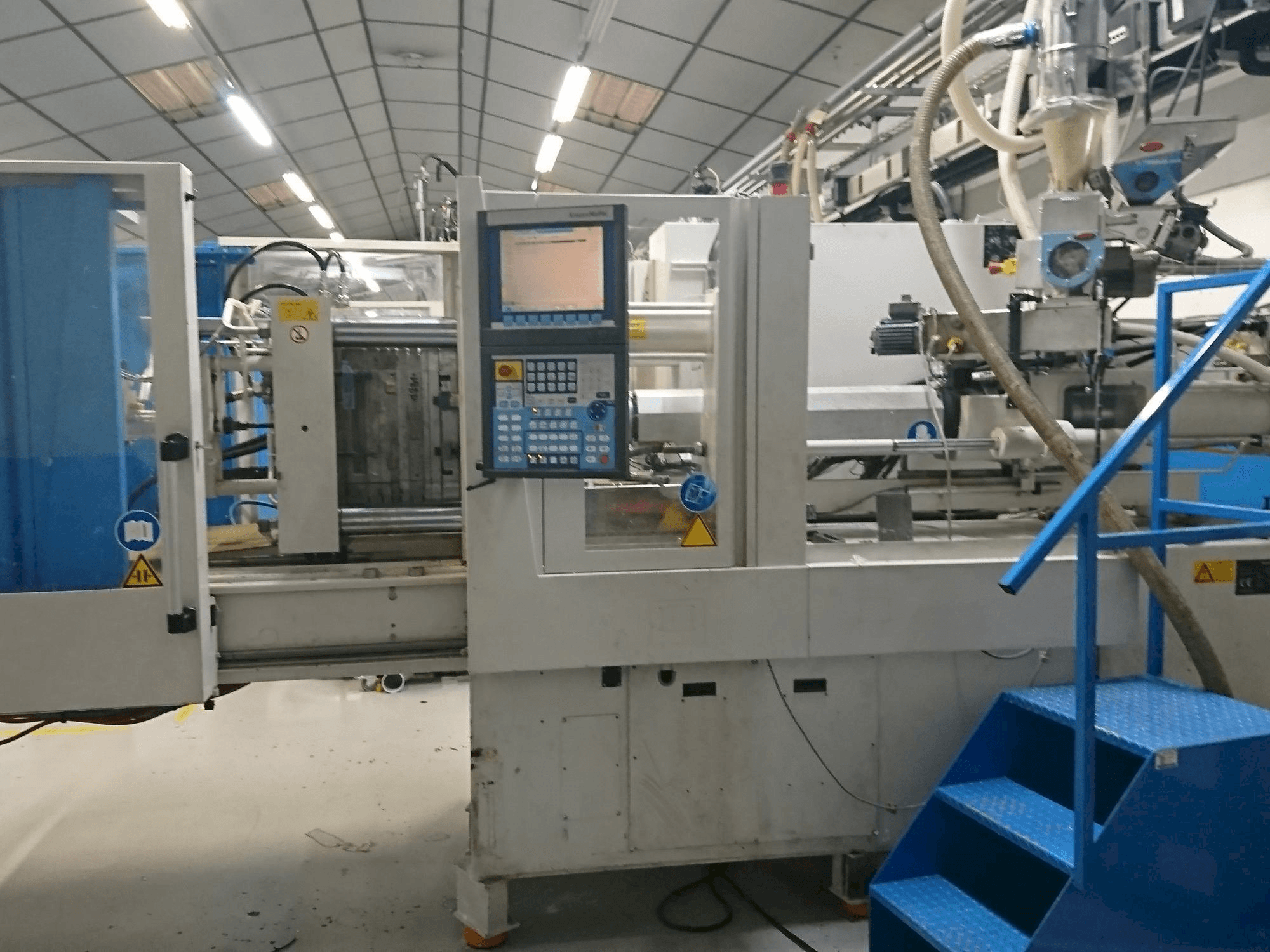 Vooraanzicht van Krauss Maffei 80-750 CX machine