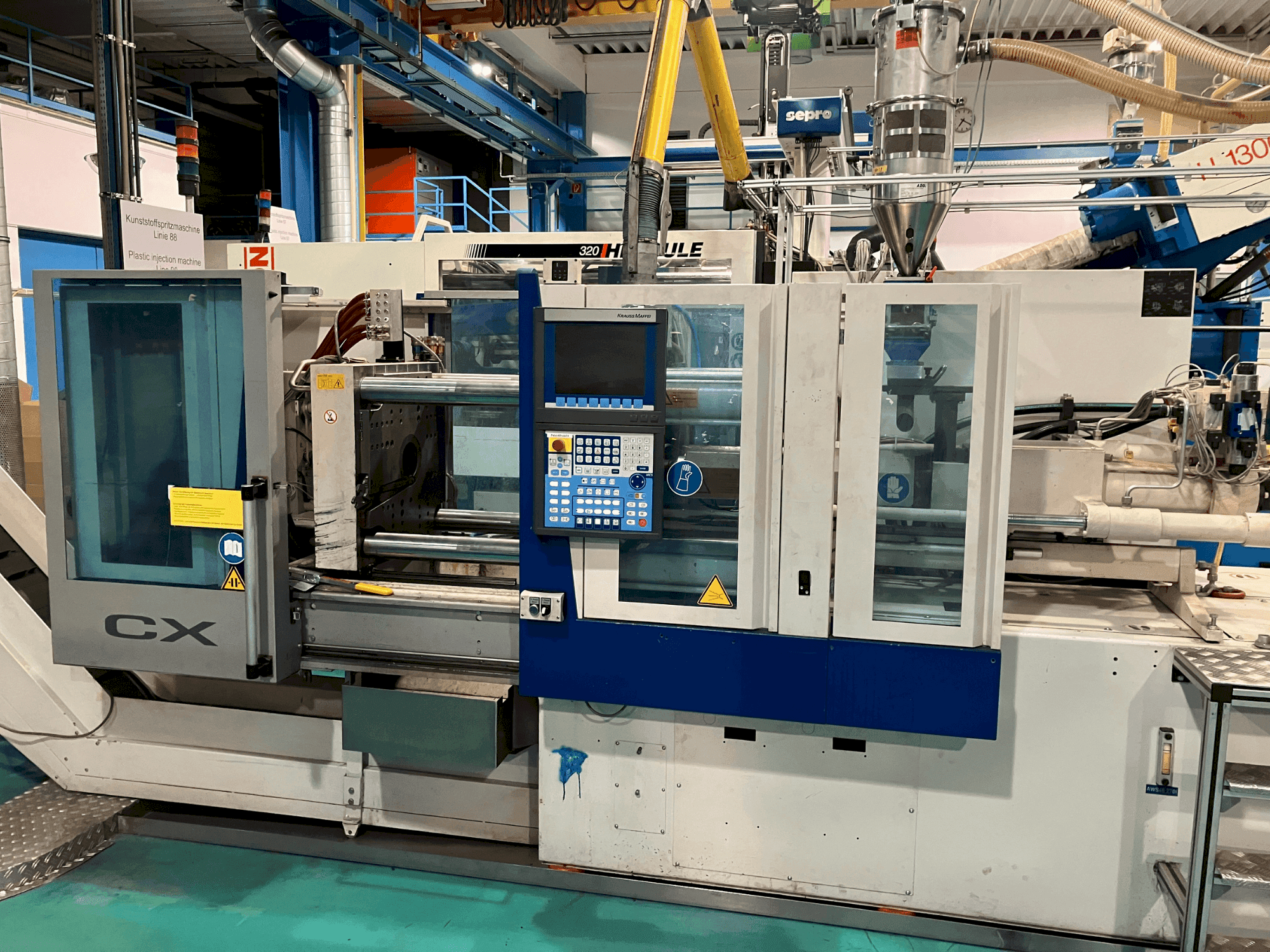 Vooraanzicht van Krauss Maffei 65-180 CX machine