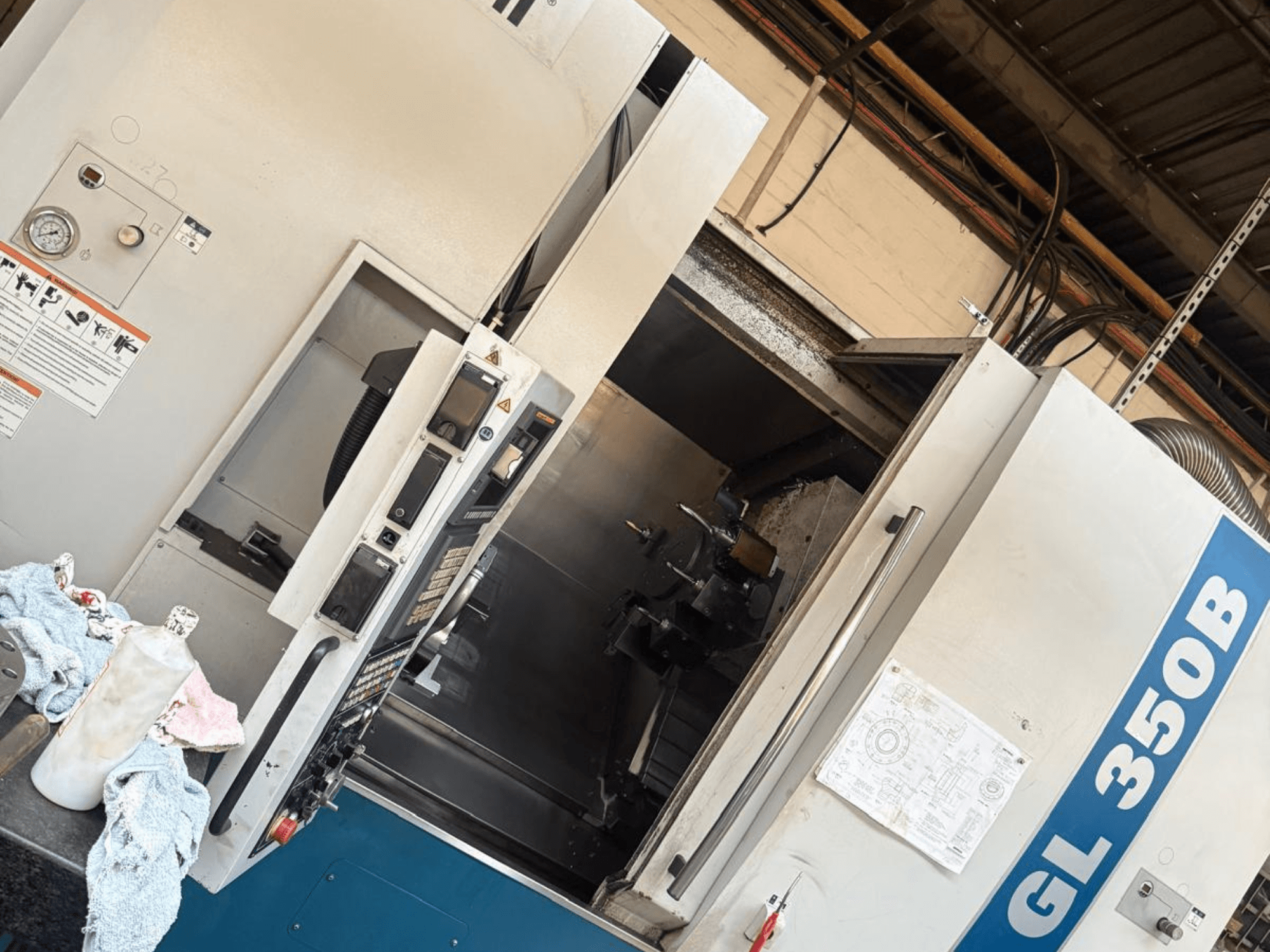 Horizontale draaimachine Romi GL 350B, vooraanzicht, met bedieningspaneel en geopende deur die het interieur onthult.