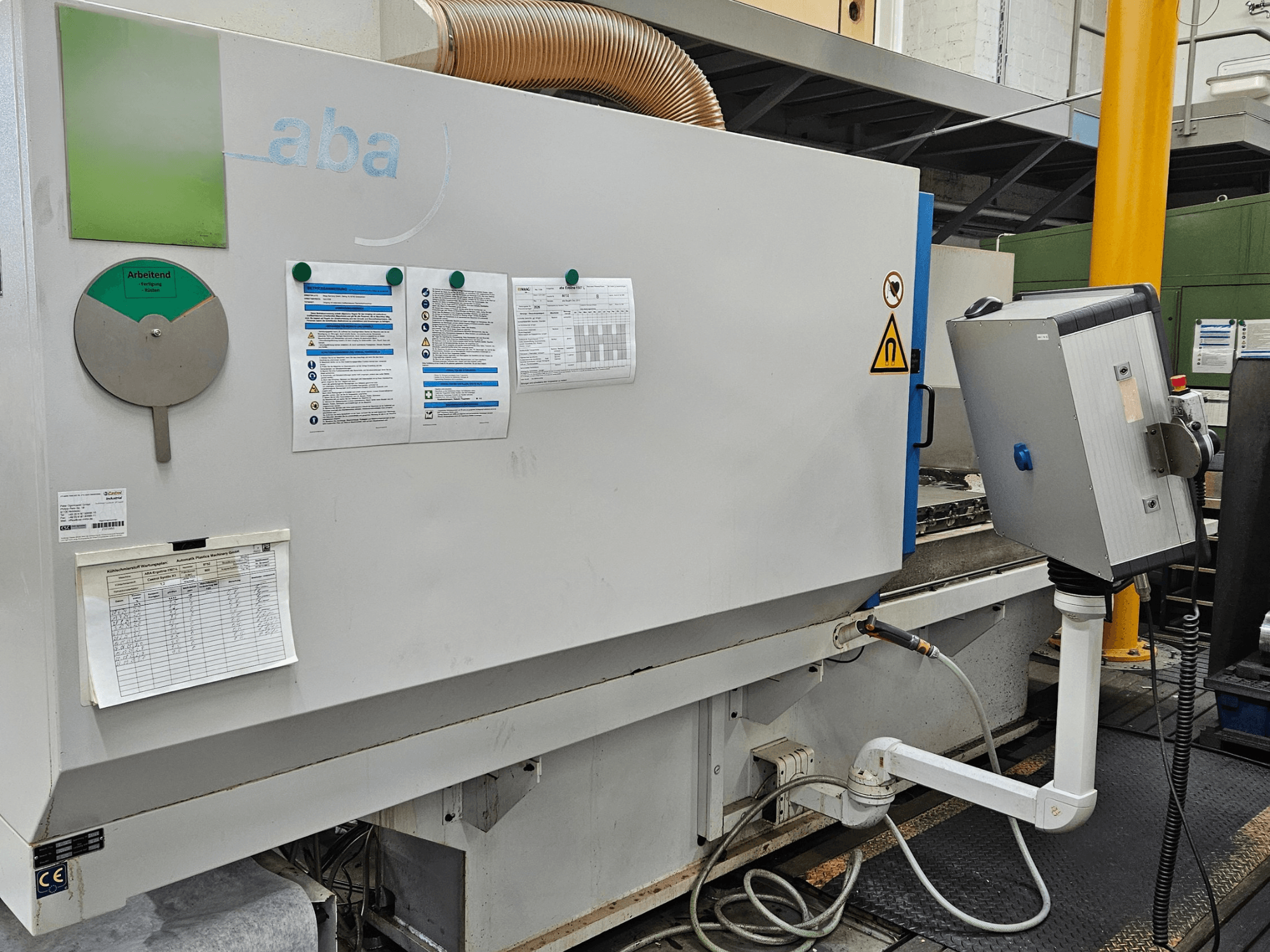 Vooraanzicht van ABA ECOLINE 1507 vlakslijpmachine met bedieningspaneel, veiligheidswaarschuwingen en bedieningsrichtlijnen zichtbaar.