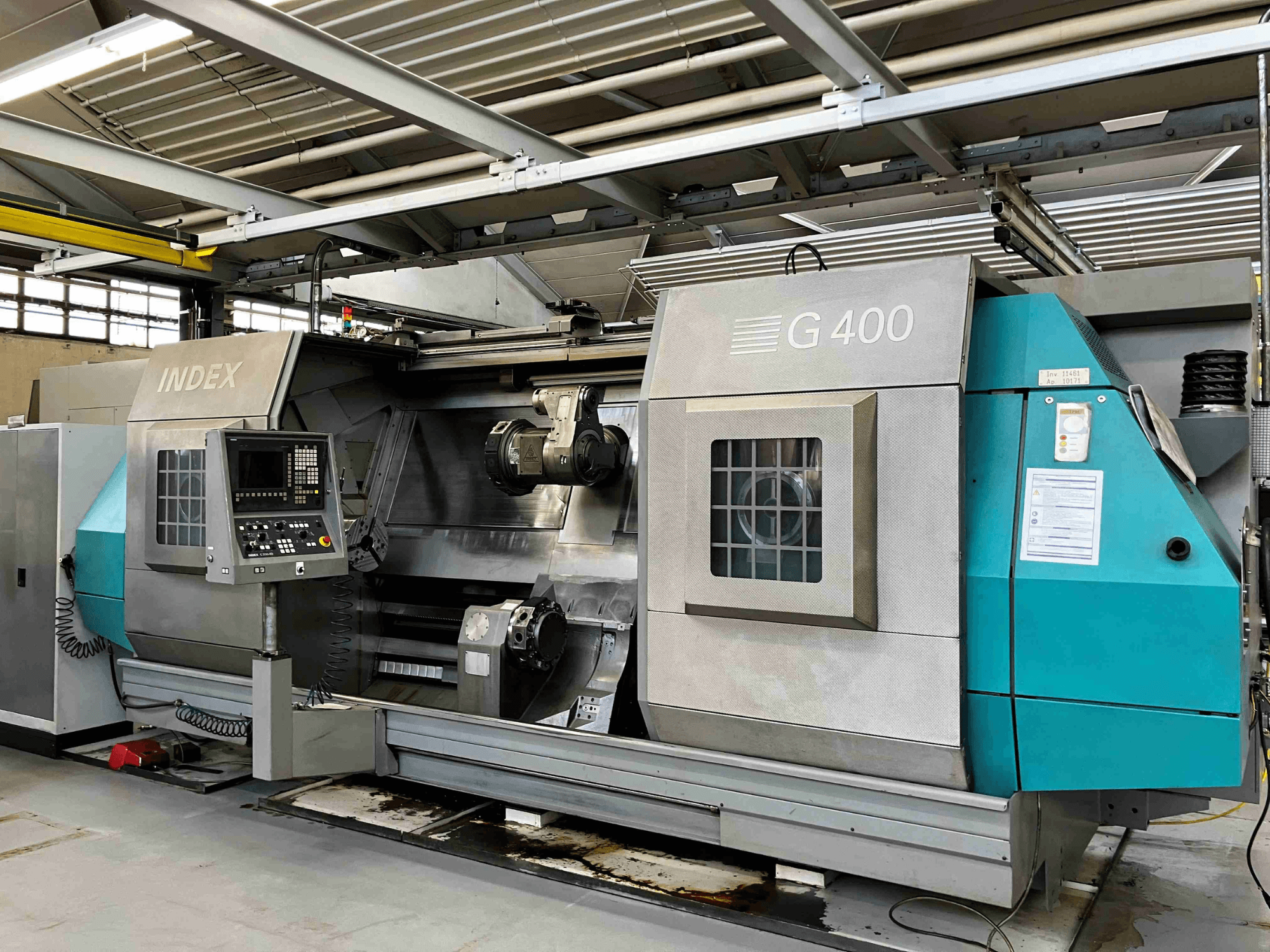 INDEX G400 CNC draaibank, vooraanzicht, met bedieningspaneel met numeriek display en dubbele spindel voor precisiebewerking.