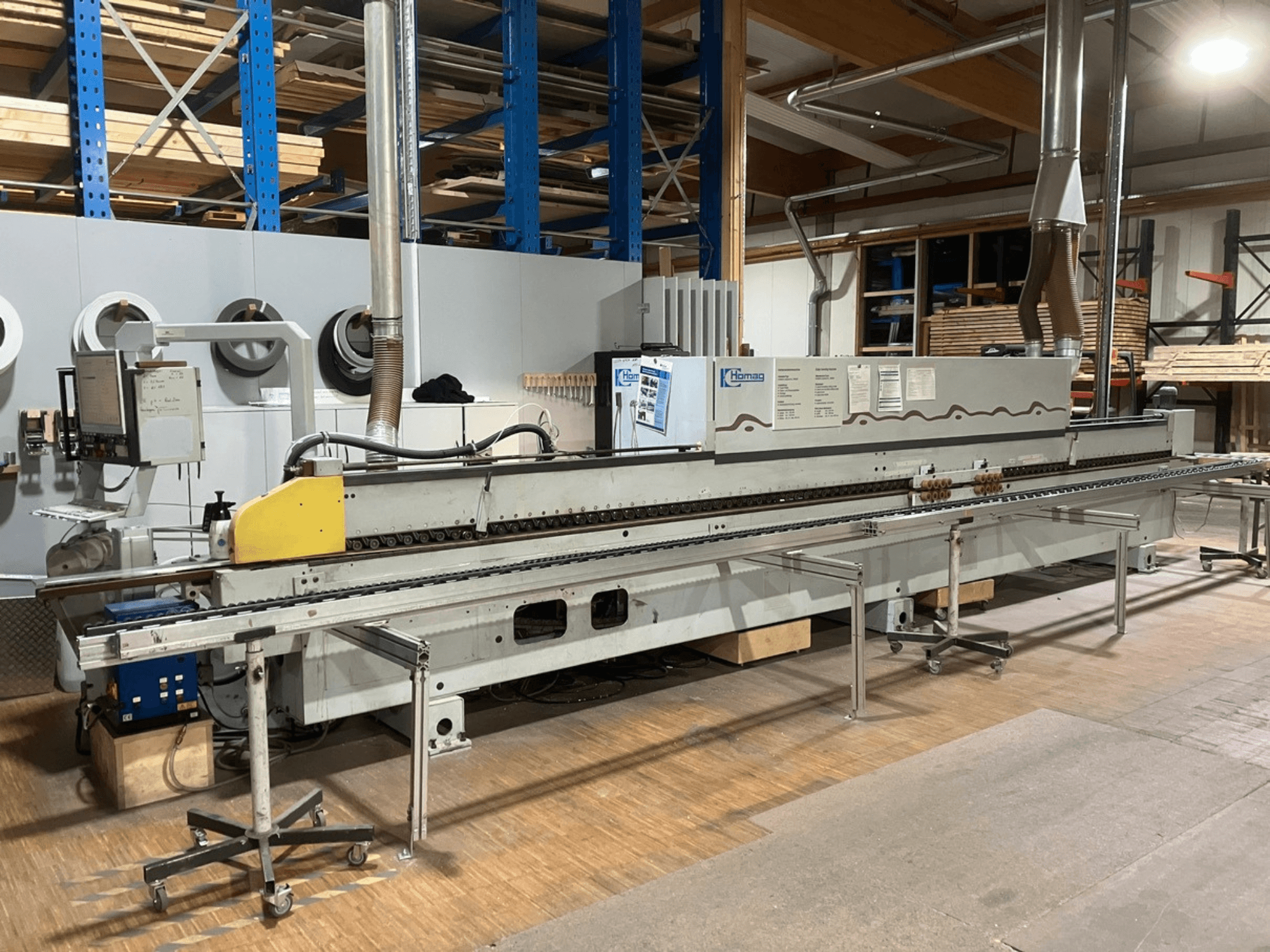 HOMAG Optimat KL 78/A20/S2 kantenlijmmachine in zijaanzicht, met bedieningspaneel, transportband en stofafzuigsysteem.