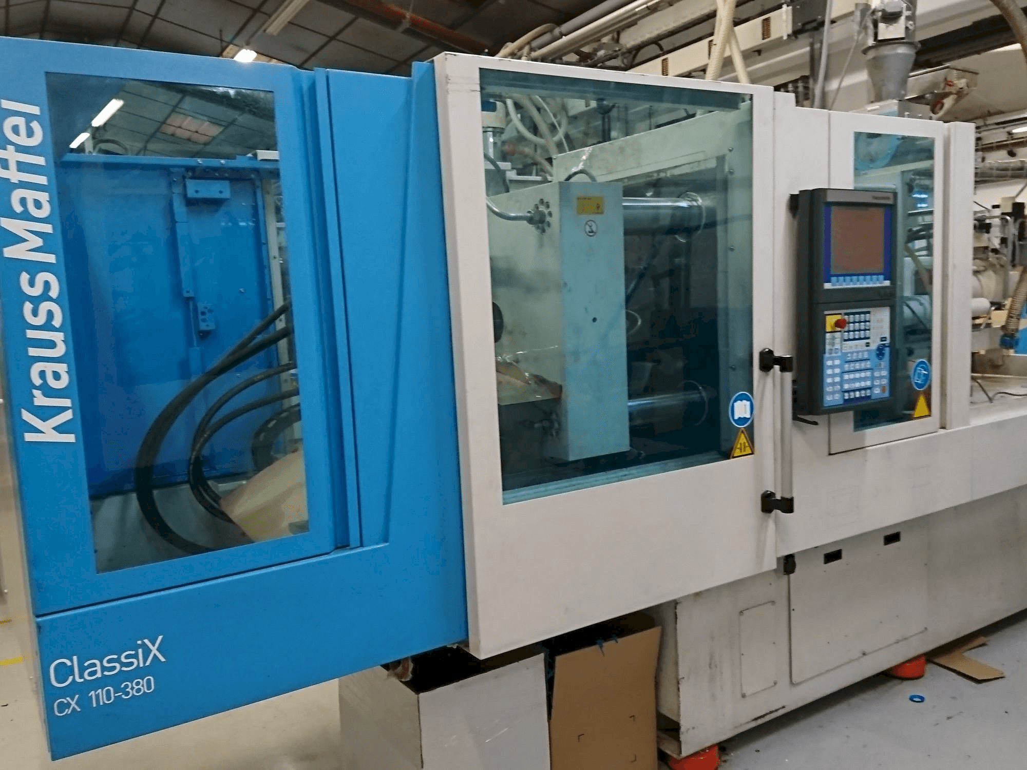 Vooraanzicht van Krauss Maffei 110-380 CX machine