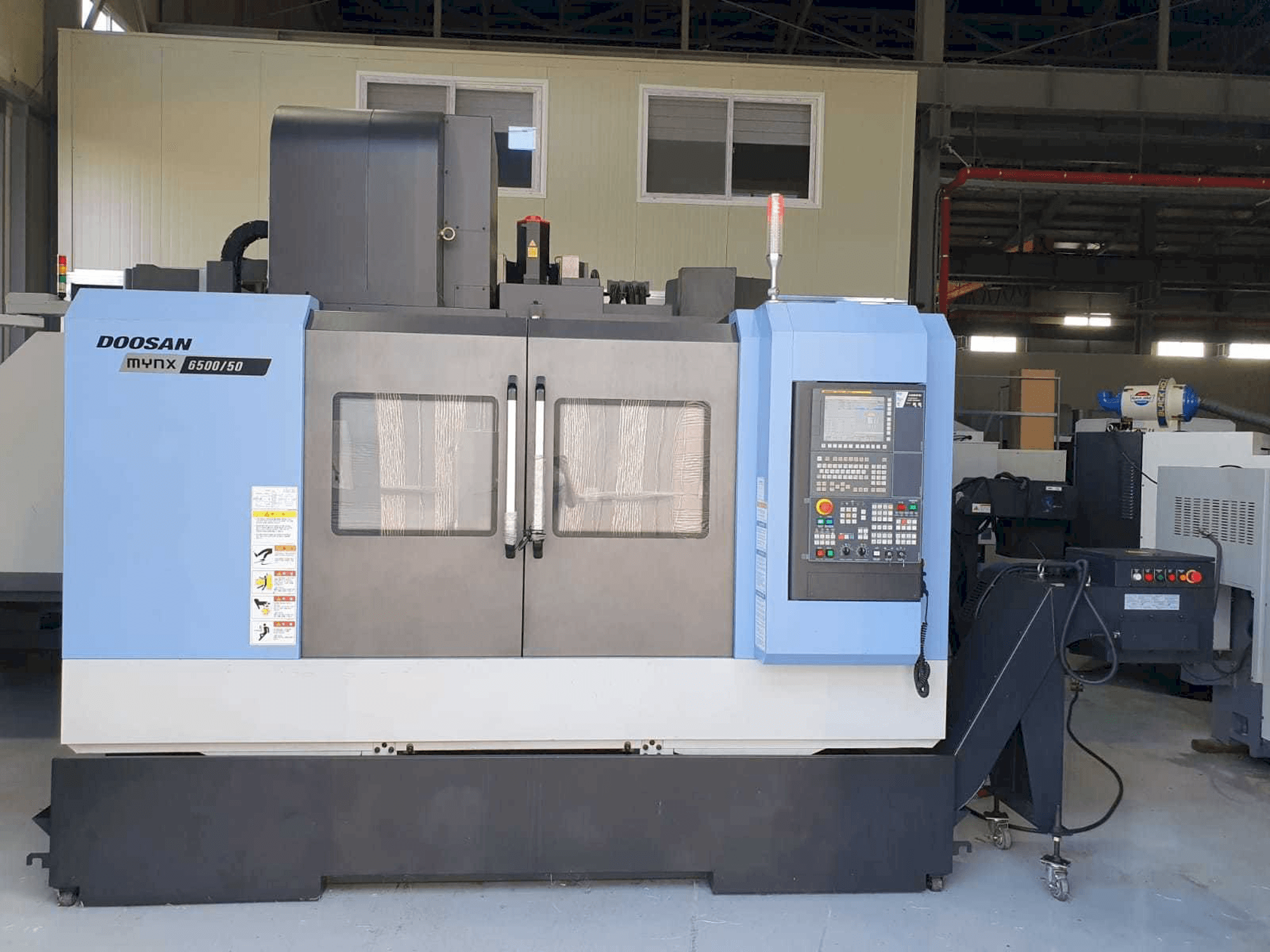 Vooraanzicht van Doosan Mynx 6500/50 machine