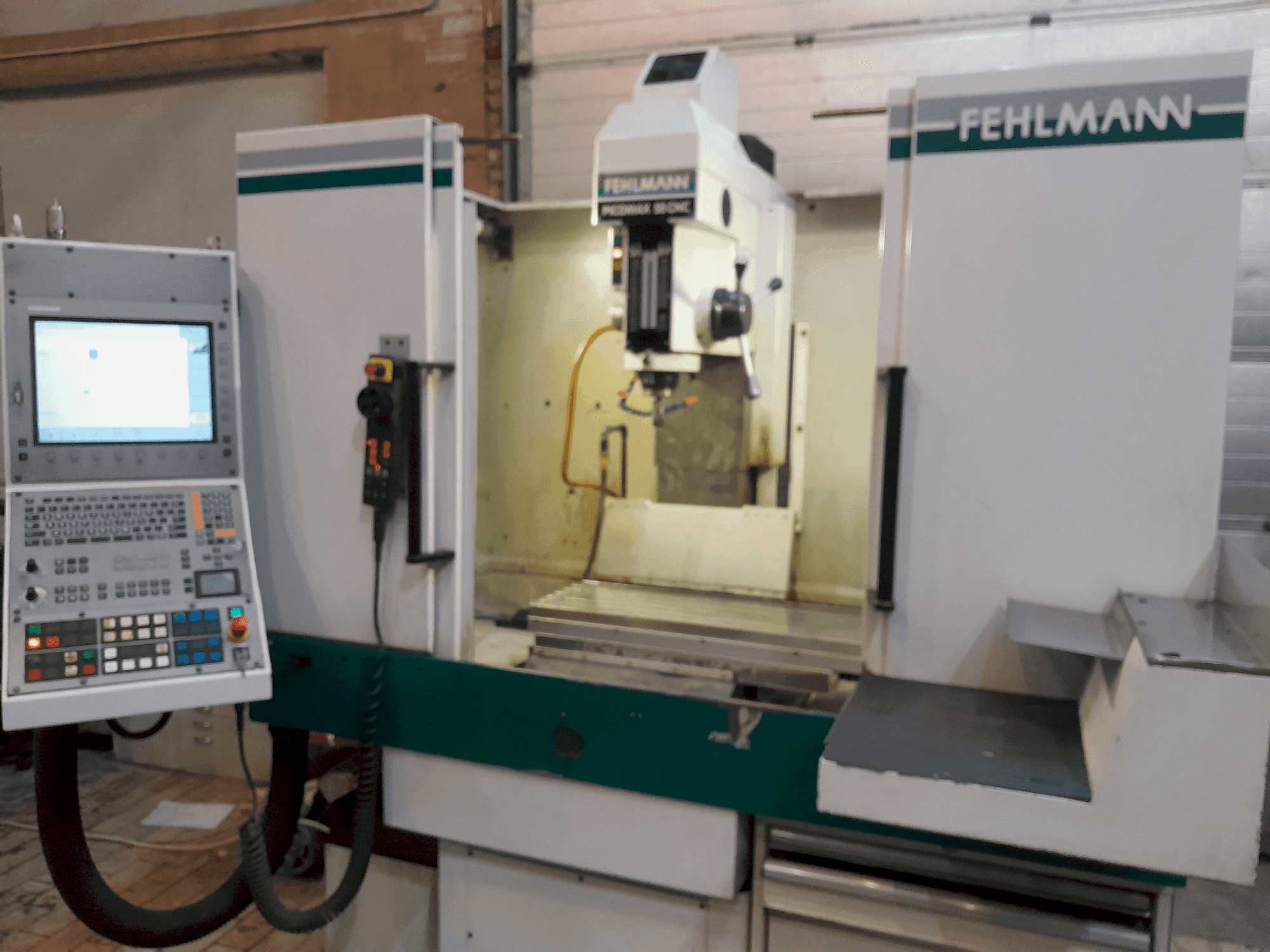 Vooraanzicht van FEHLMANN PICOMAX 55 CNC 2/3 machine