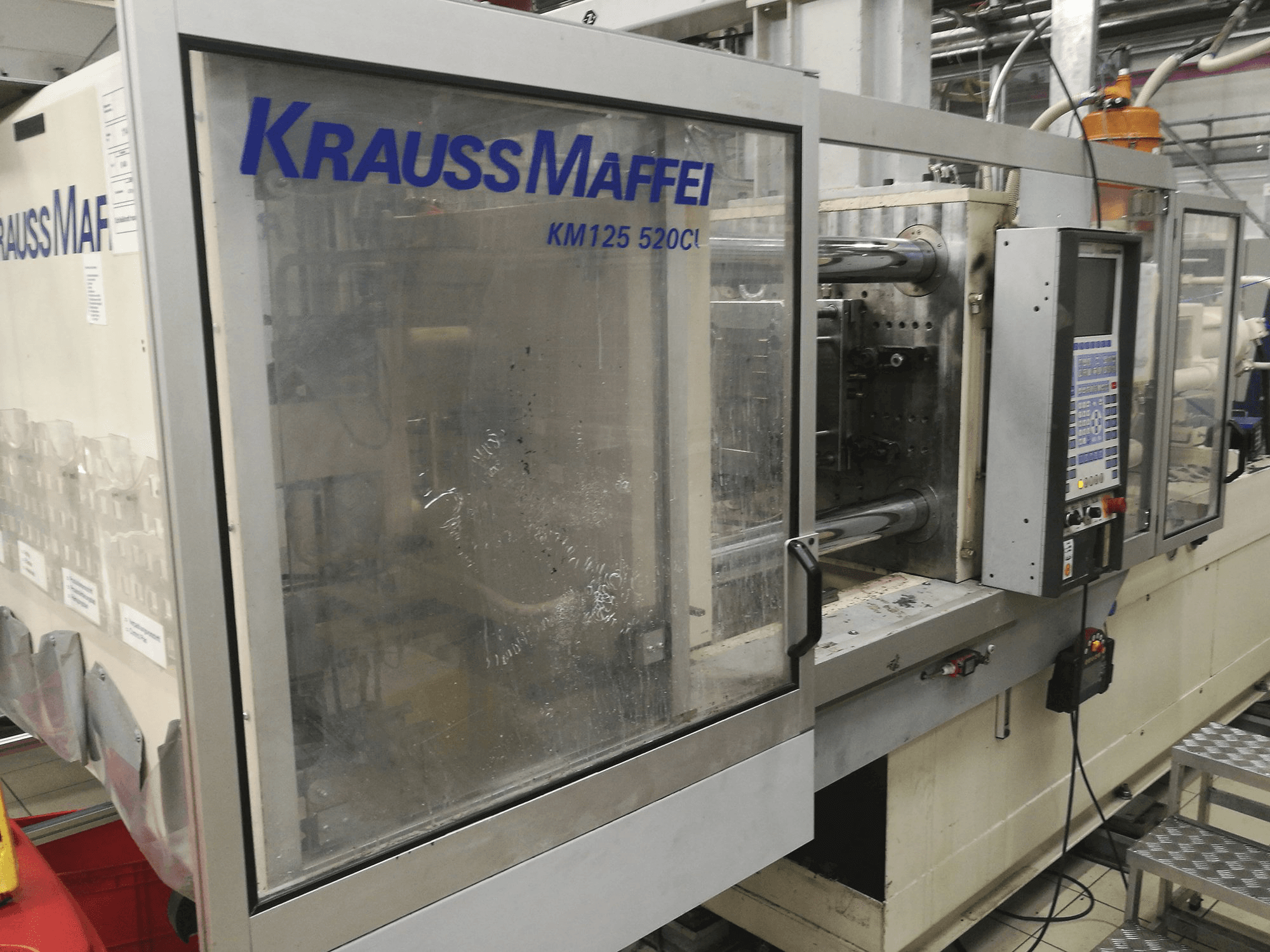Vooraanzicht van Krauss Maffei KM 125-520 C1 machine
