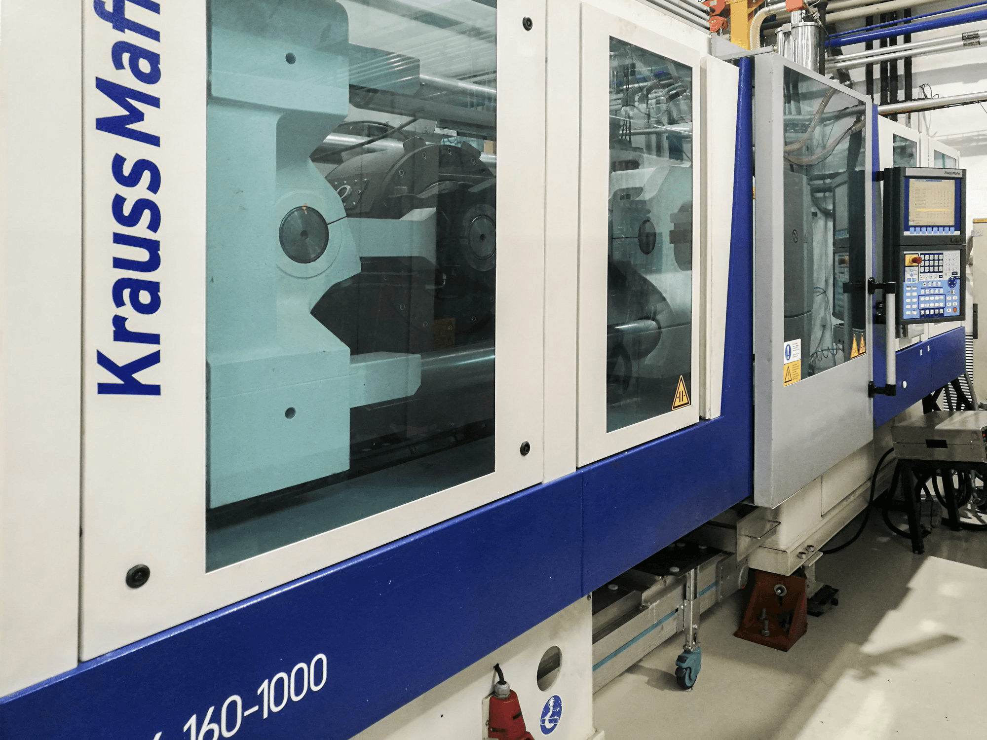 Links zicht van Krauss Maffei 160-1000 EX machine